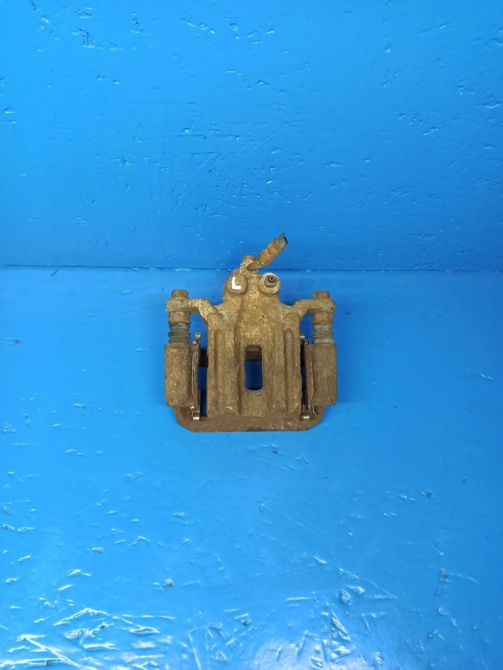 Суппорт тормозной задний левый Nissan Pathfinder III (2004—2010) б.у