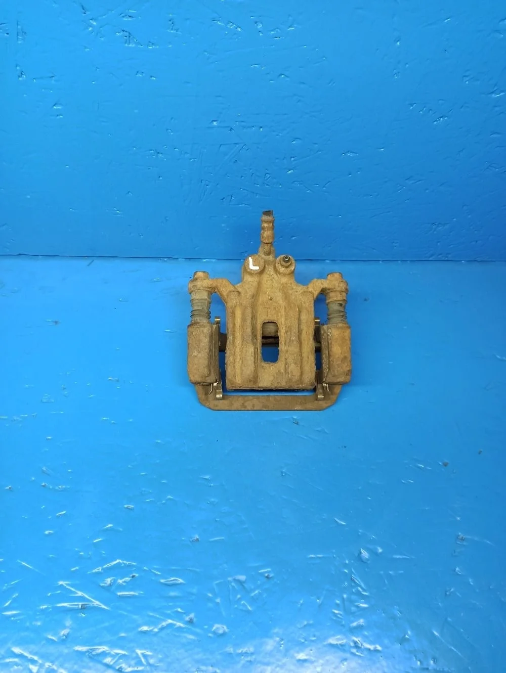 Суппорт тормозной задний левый Nissan Pathfinder III (2004—2010) б.у