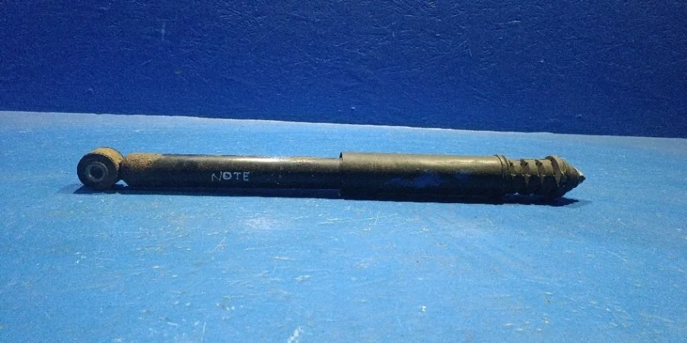 Амортизатор задний L=R Nissan Note E11 (2005—2009) б.у