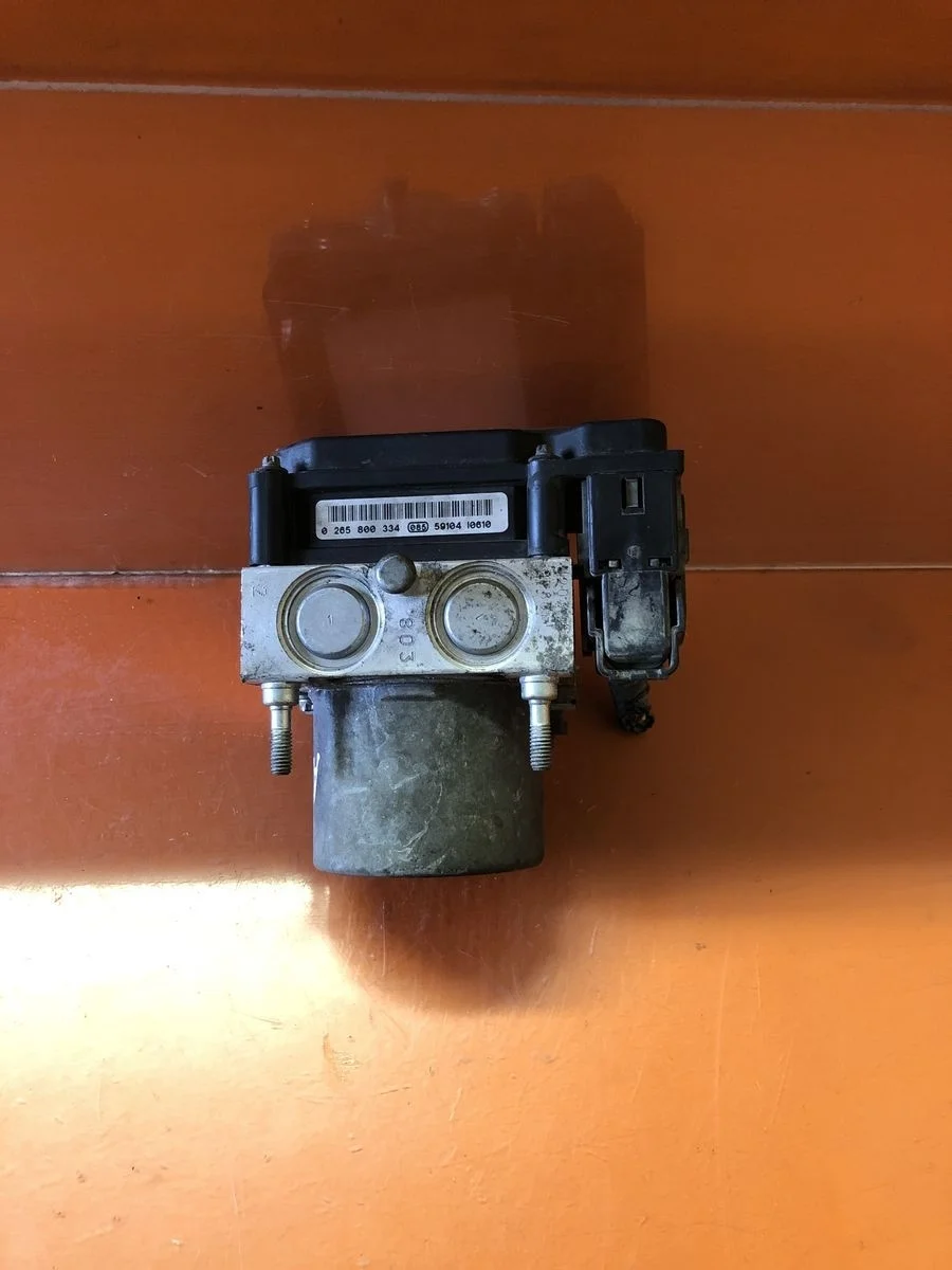 Блок (насос) ABS Nissan Primera P12 (2001—2008) б.у