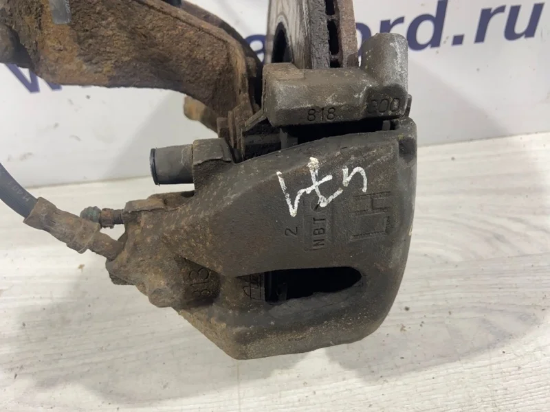 Суппорт передний левый Ford Focus 2 (04-08)