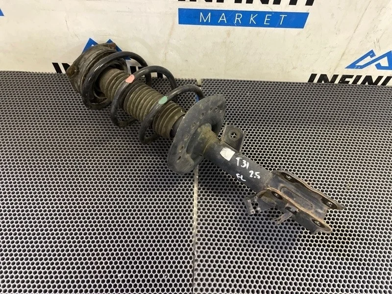 Амортизатор стойка подвески передний левый NISSAN