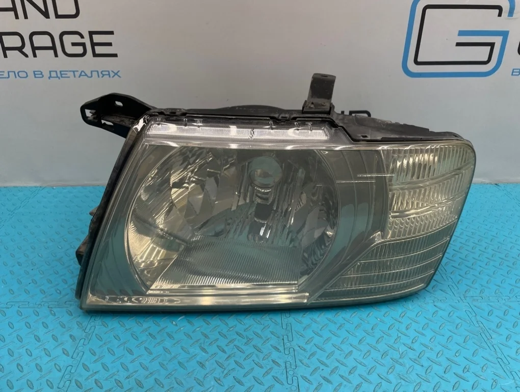 Фара Mitsubishi Pajero 2002 MN117097 V75W 6G74 3.5, левая