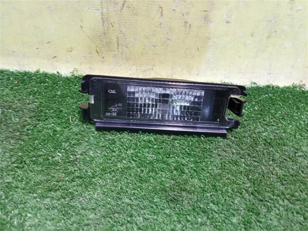 Фонарь подсветки номера  Renault Logan 2005  8200957874 20535