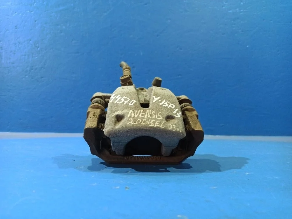 Суппорт тормозной задний левый Toyota Avensis 250