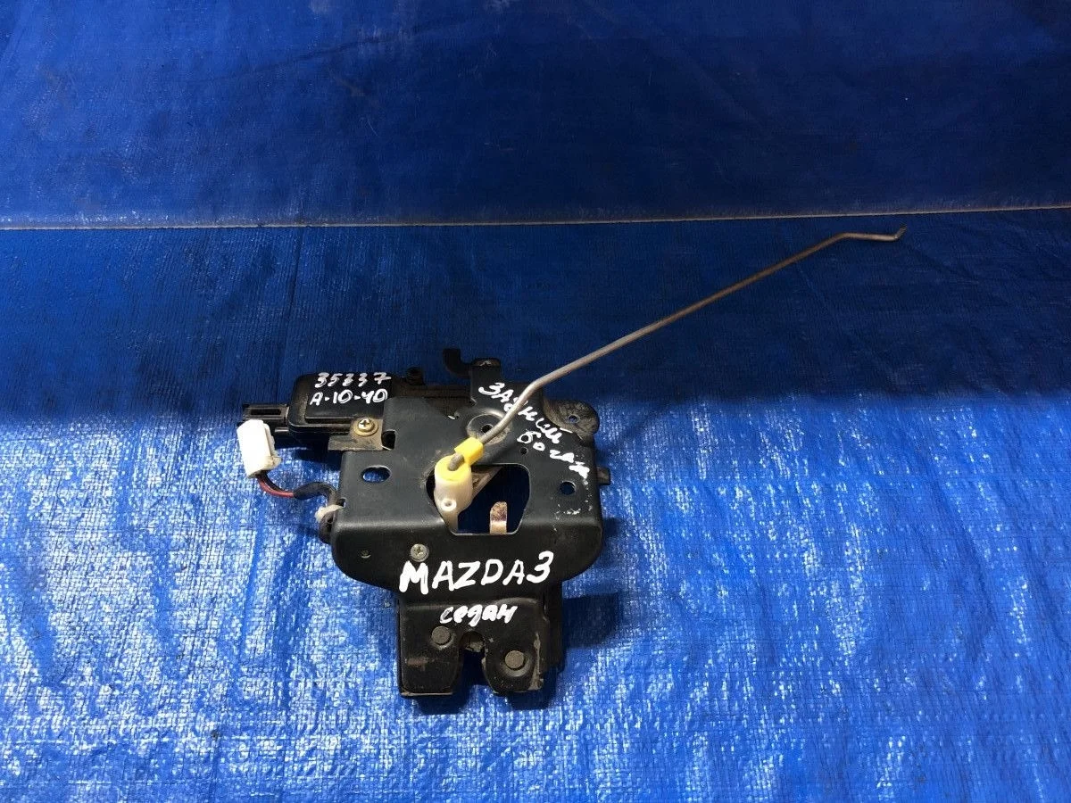 Замок багажника Mazda 3 BK (2003—2006)
