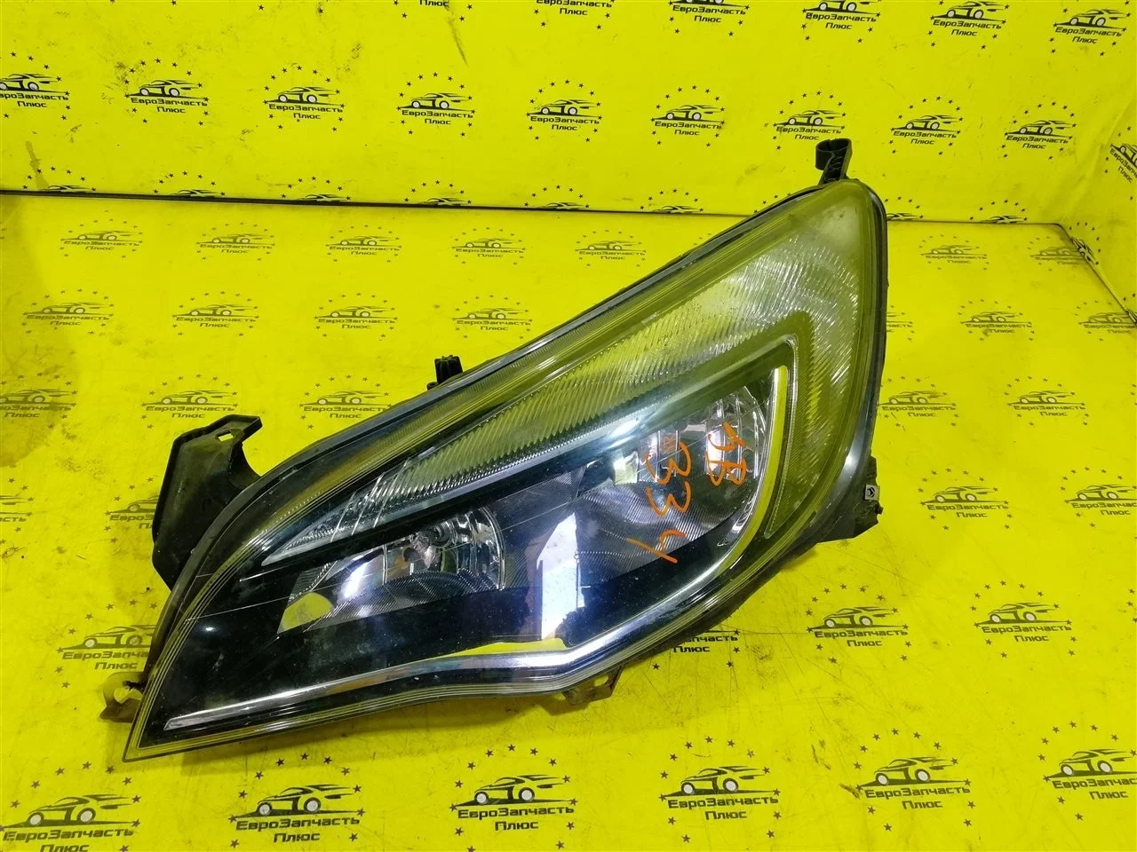 Фара Opel Astra 13253656 J, передняя левая