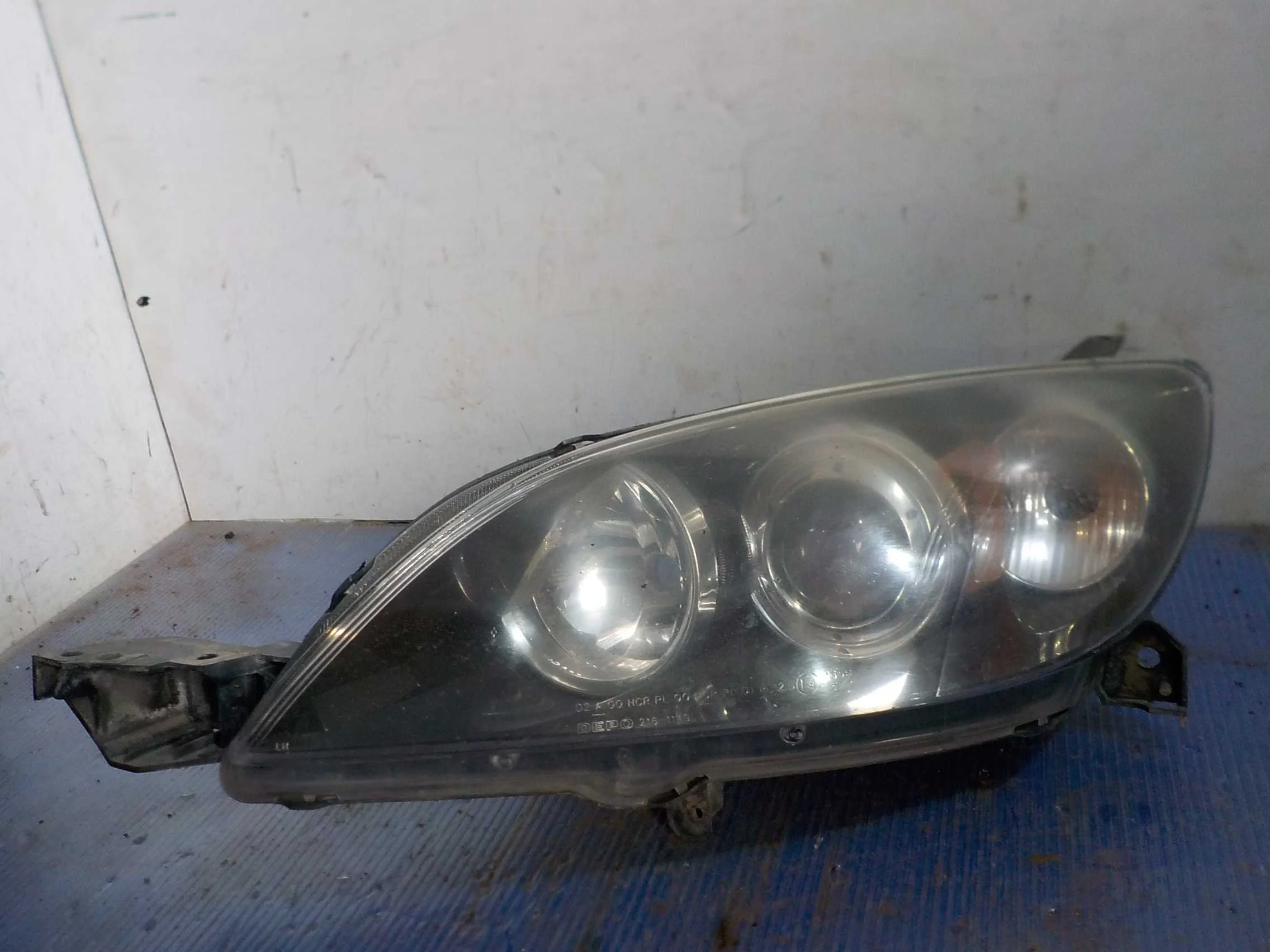 Фара Mazda 3 BK рестайлинг (2006—2009)  Лево