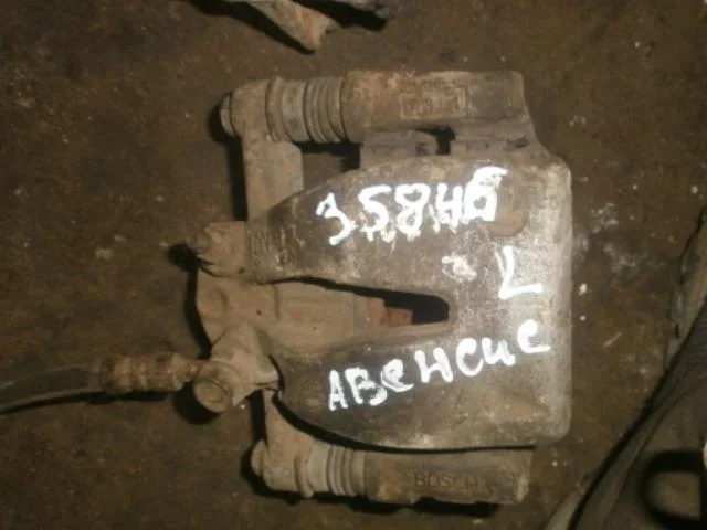 суппорт Toyota Avensis T250 (2003—2006) Зад Лево