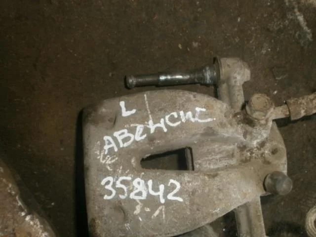 суппорт Toyota Avensis T250 (2003—2006) Зад Лево