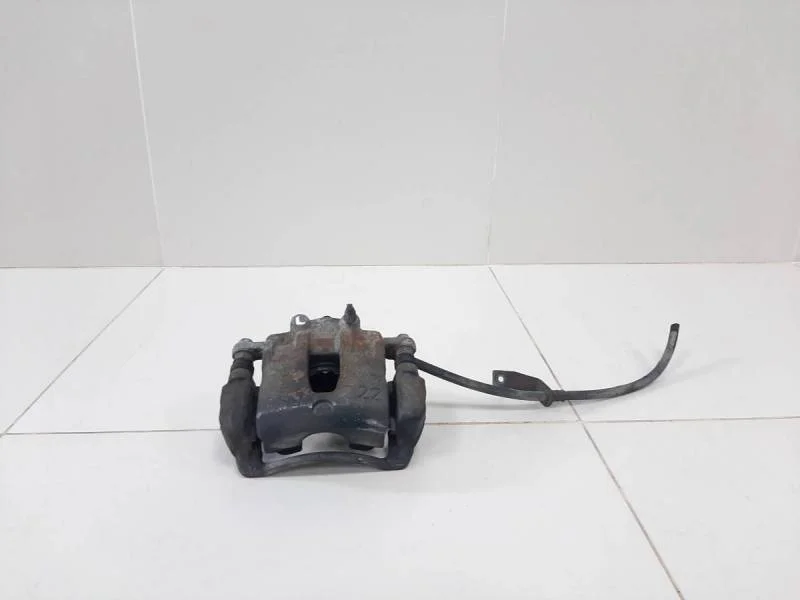 Суппорт передний левый Kia Rio 3 (UB) 2011-2017