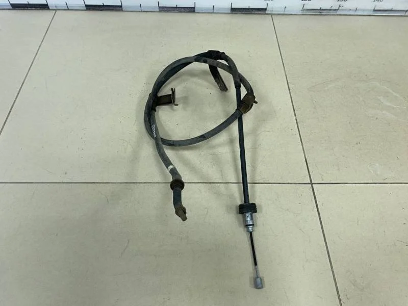 Трос стояночного тормоза левый Kia Rio 3 (UB) 2011-2017