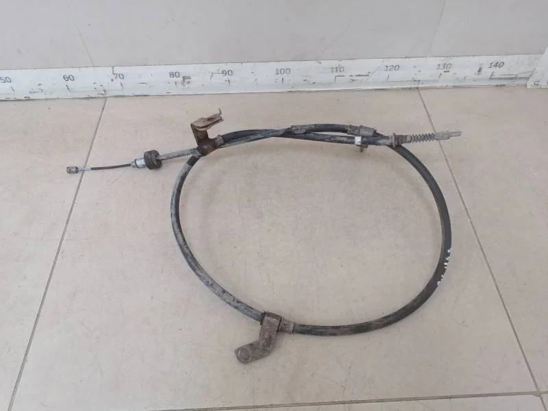 Трос стояночного тормоза левый Kia Rio 3 (UB) 2011-2017