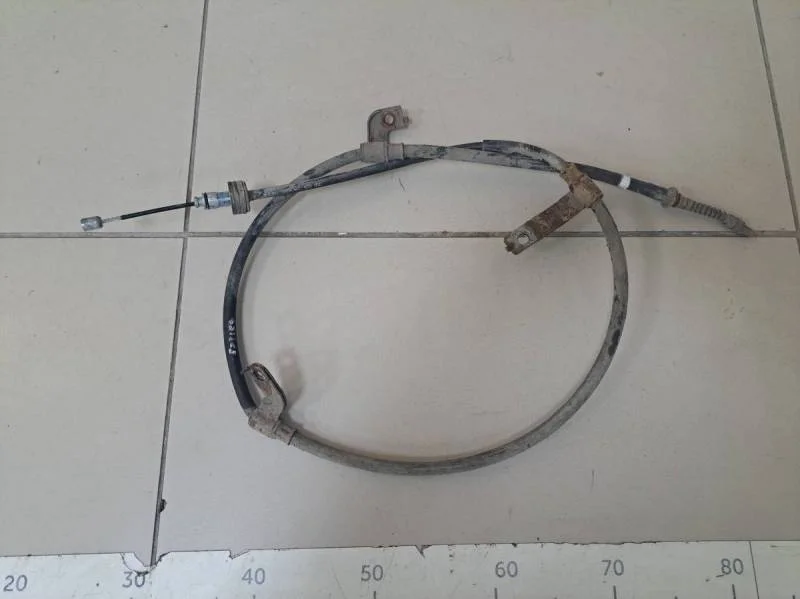 Трос стояночного тормоза левый Hyundai Solaris 2010-2017