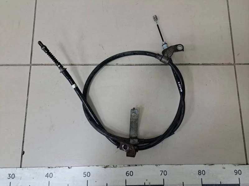 Трос стояночного тормоза левый Hyundai Solaris 2010-2017