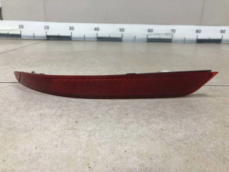 Отражатель в бампер задний левый Nissan Almera 3 (G11, G15) 2012>