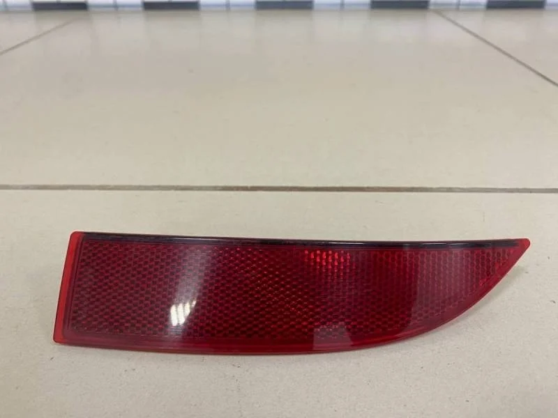 Отражатель в бампер задний левый Renault Sandero 2014>