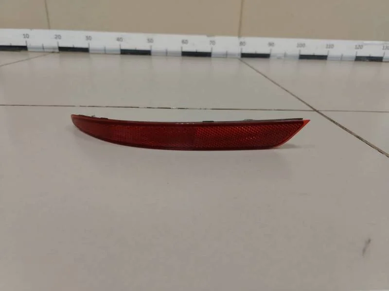 Отражатель в бампер задний левый Nissan Almera 3 (G11, G15) 2012>