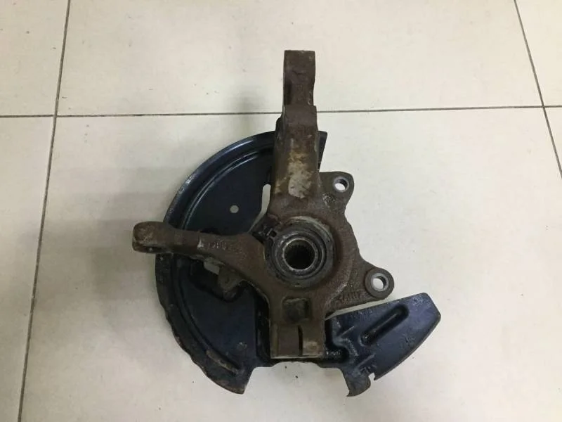 Кулак поворотный передний левый Nissan Almera 3 (G11, G15) 2012>