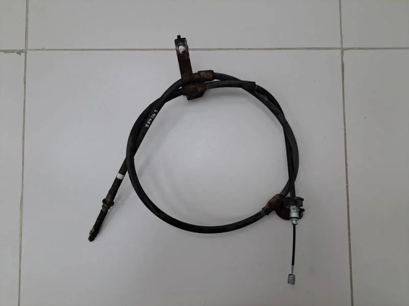 Трос стояночного тормоза левый Hyundai Solaris 2010-2017