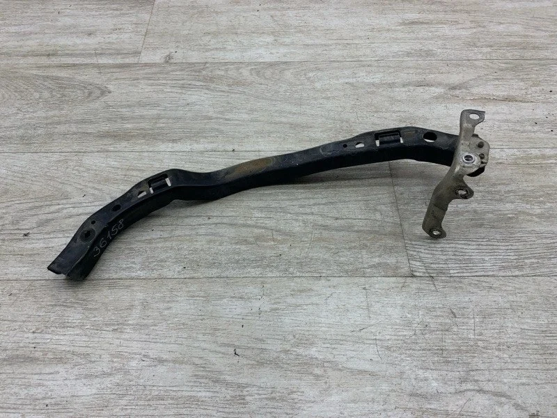 Кронштейн крепления фары Subaru Outback 2006 57707AG070 УНИВЕРСАЛ EJ25, передний левый