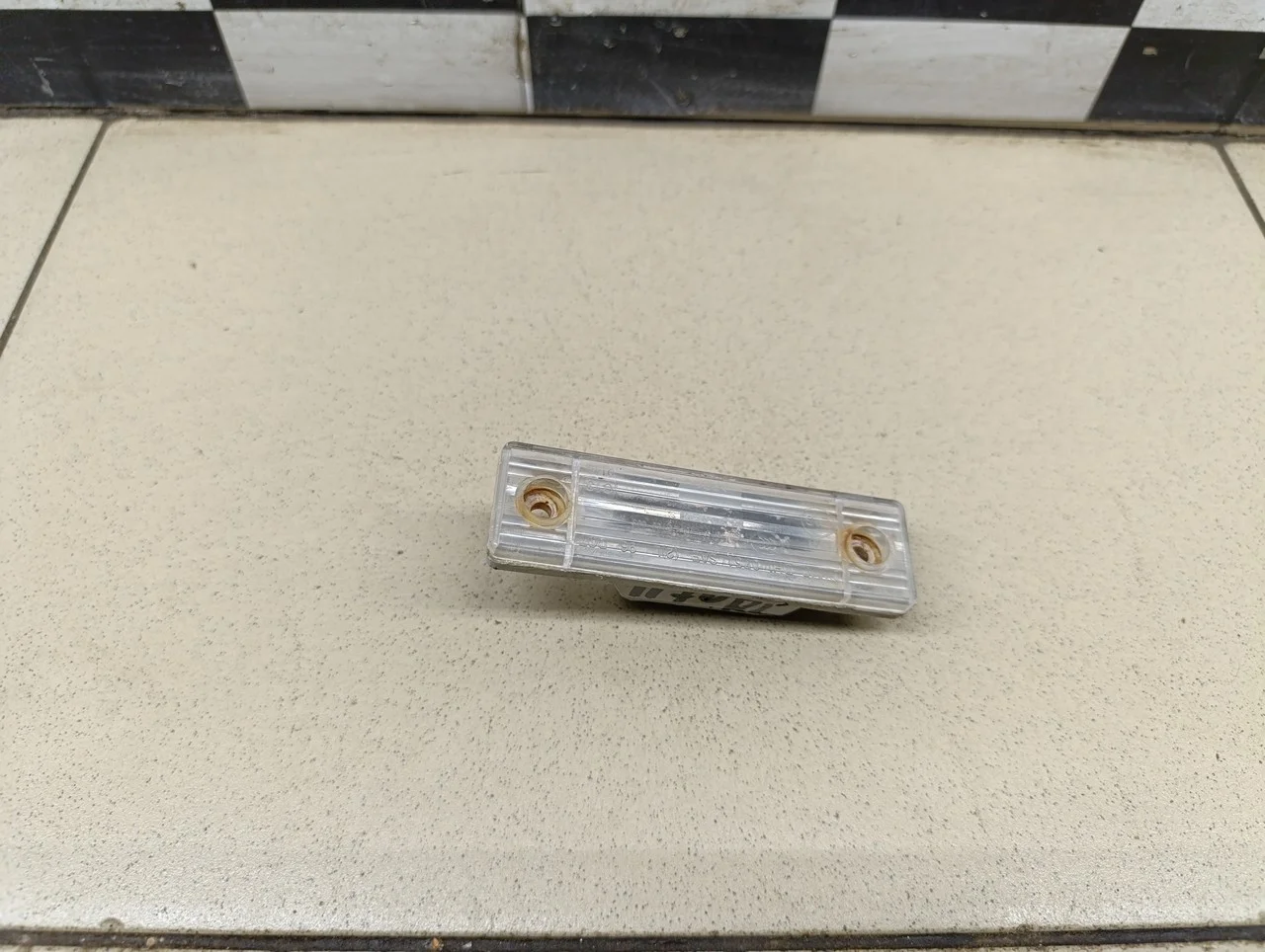 Фонарь подсветки номера Aveo (T200) 2003-2008