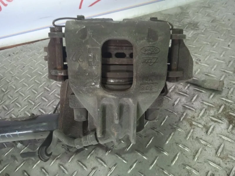Суппорт тормозной Ford Focus 1