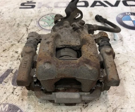 Суппорт задний левый для Skoda Octavia A5 на фотографиях