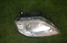 Фара ксенон левая для Renault Logan 2008 года на фотографиях