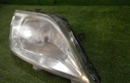 Фара ксенон левая для Renault Logan 2008 года на фотографиях