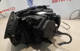 Фара ксенон левая для BMW X3 2008 года на фотографиях