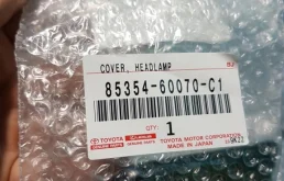 Крышка форсунки фароомывателя левая для Toyota Land Cruiser на фотографиях