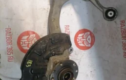 Кулак поворотный левый для Audi A4 2006 года на фотографиях