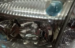 Фара левая для Nissan X-Trail 2000 года на фотографиях