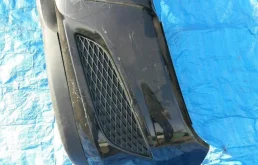 Бампер передний для Opel Astra 2011 года на фотографиях